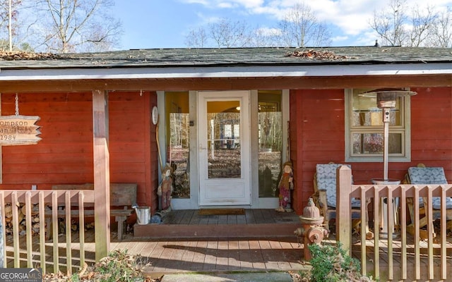 doorway to property featuring a porch