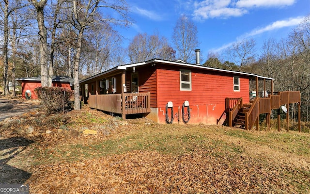 805 Quail Cove Cir, Warne, NC 28909 - back of property with a deck and stairs