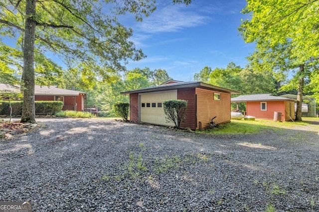 805 Quail Cove Cir, Warne, NC 28909 - detached garage with gravel driveway