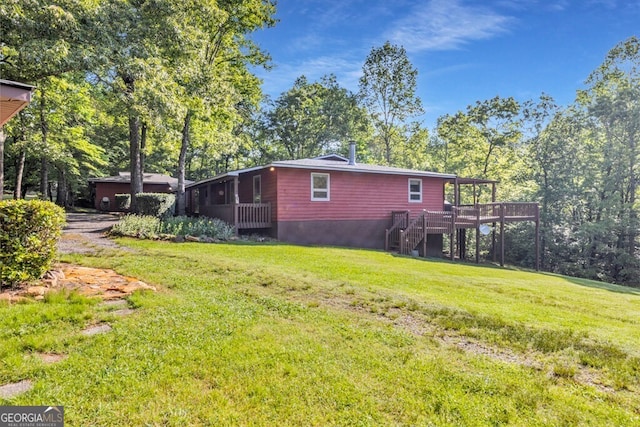 805 Quail Cove Cir, Warne, NC 28909 - view of home's exterior featuring stairs, a deck, a yard, and view of wooded area