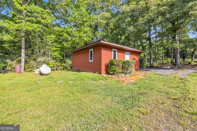 805 Quail Cove Cir, Warne, NC 28909 - view of side of home with a lawn