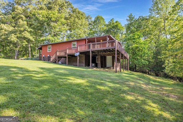 805 Quail Cove Cir, Warne, NC 28909 - back of property with a wooden deck, stairs, and a yard