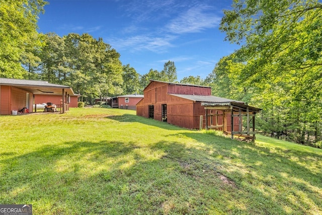 805 Quail Cove Cir, Warne, NC 28909 - view of grassy yard with an outdoor structure