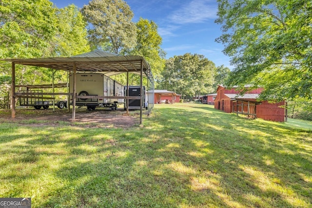 805 Quail Cove Cir, Warne, NC 28909 - view of grassy yard with a carport