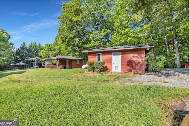 805 Quail Cove Cir, Warne, NC 28909 - view of green lawn with an outbuilding
