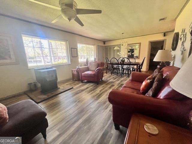 living room featuring hardwood / wood-style flooring and ceiling fan