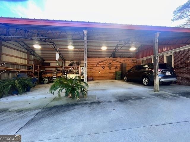 view of garage at dusk