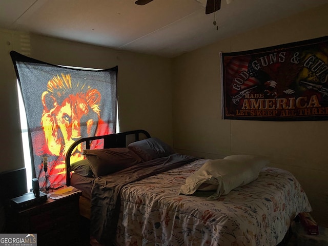 bedroom featuring lofted ceiling and ceiling fan