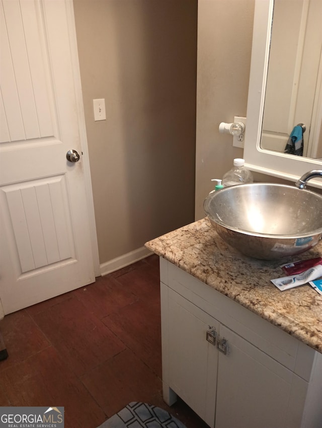 bathroom with vanity and wood-type flooring