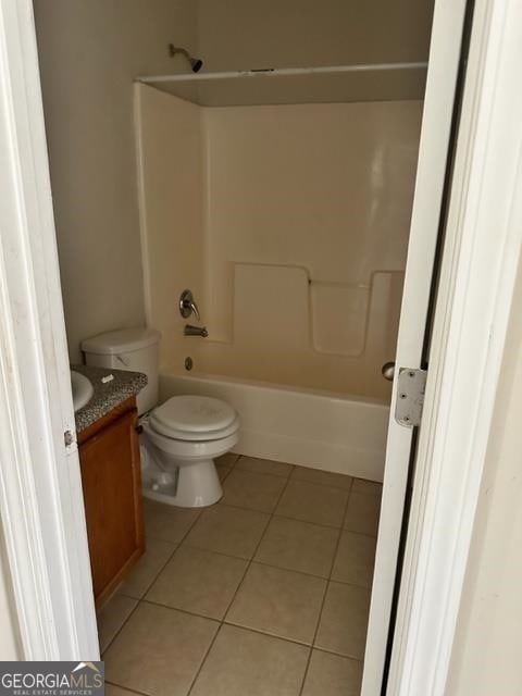 full bathroom featuring vanity, toilet, shower / bath combination, and tile patterned floors