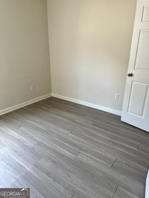 spare room with hardwood / wood-style floors