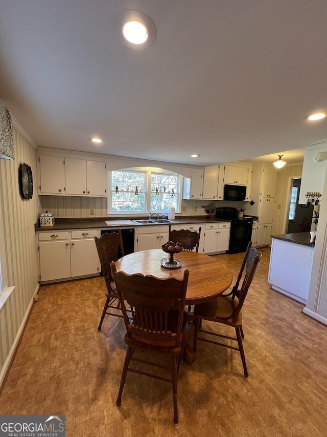 dining room with recessed lighting