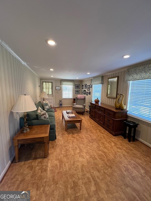 living room with crown molding and recessed lighting