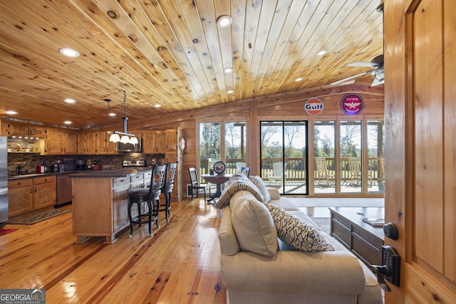 living room featuring wooden ceiling, ceiling fan with notable chandelier, vaulted ceiling, and light wood-type flooring