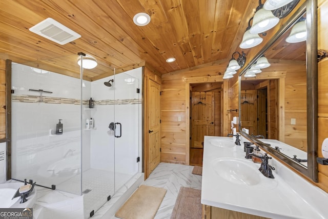 bathroom featuring tile floors, dual sinks, vanity with extensive cabinet space, wooden walls, and wood ceiling