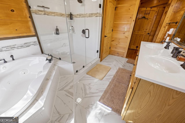 bathroom featuring vanity with extensive cabinet space, dual sinks, tile floors, and plus walk in shower