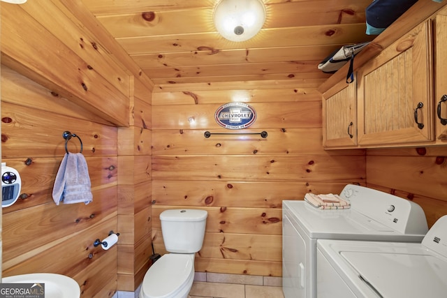 washroom featuring tile floors, wood ceiling, separate washer and dryer, and wood walls