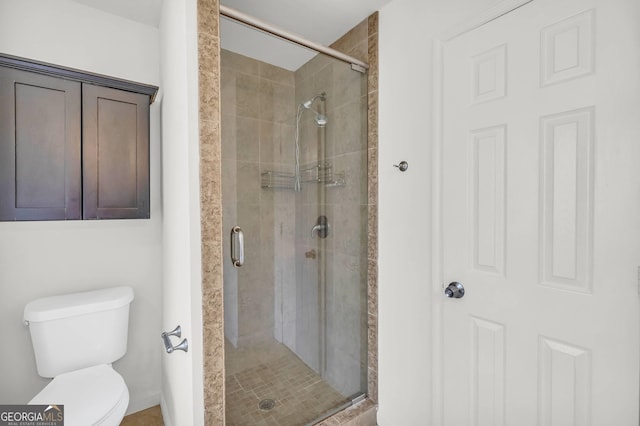 bathroom with toilet and walk in shower