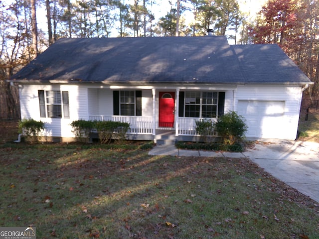 ranch-style home featuring a garage, a front lawn, and covered porch