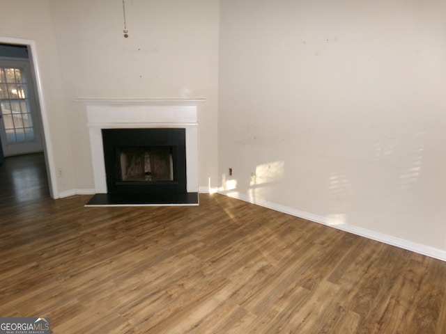 unfurnished living room with hardwood / wood-style floors