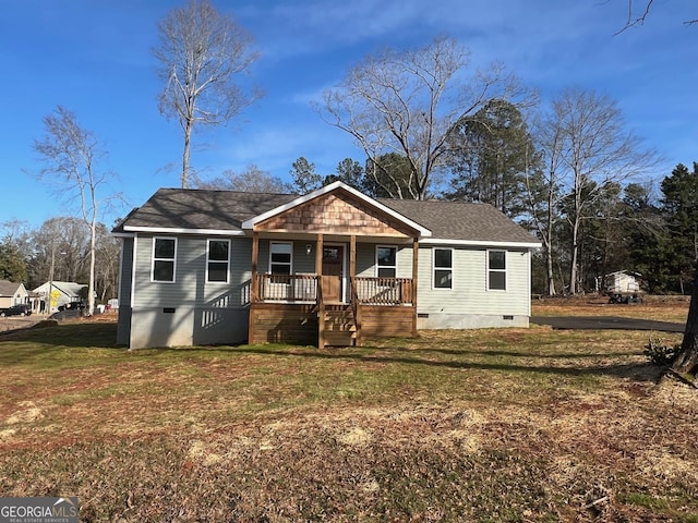 bungalow-style house with covered porch and a front yard