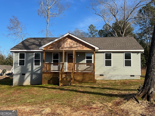 view of front of house featuring a front yard and covered porch