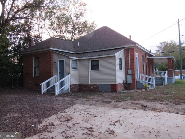 4154 Houston Ave, Macon, GA 31206 - view of front of house featuring entry steps, roof with shingles, and crawl space