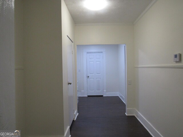 4154 Houston Ave, Macon, GA 31206 - corridor featuring baseboards, a textured ceiling, crown molding, and dark wood-style floors