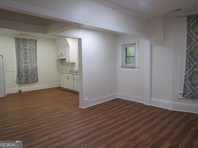 4154 Houston Ave, Macon, GA 31206 - basement with dark wood-style flooring, baseboards, freestanding refrigerator, and visible vents