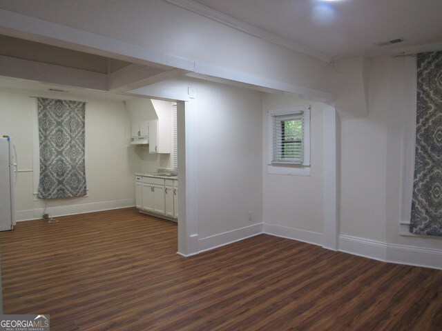 4154 Houston Ave, Macon, GA 31206 - below grade area with baseboards, freestanding refrigerator, visible vents, and dark wood-type flooring