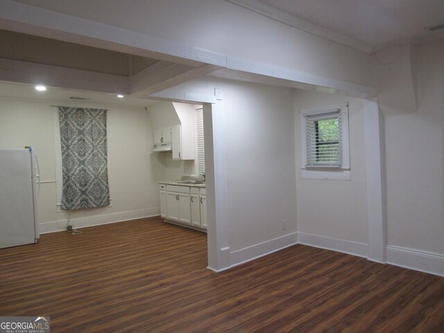 4154 Houston Ave, Macon, GA 31206 - below grade area with a sink, freestanding refrigerator, dark wood-style flooring, and baseboards