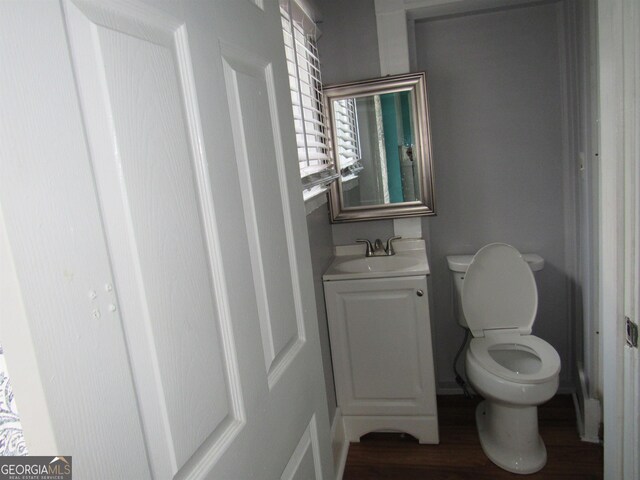 4154 Houston Ave, Macon, GA 31206 - bathroom with toilet, wood finished floors, and vanity