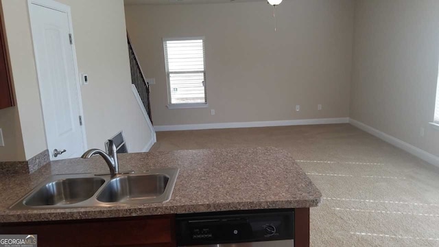 kitchen with sink, carpet floors, and dishwasher