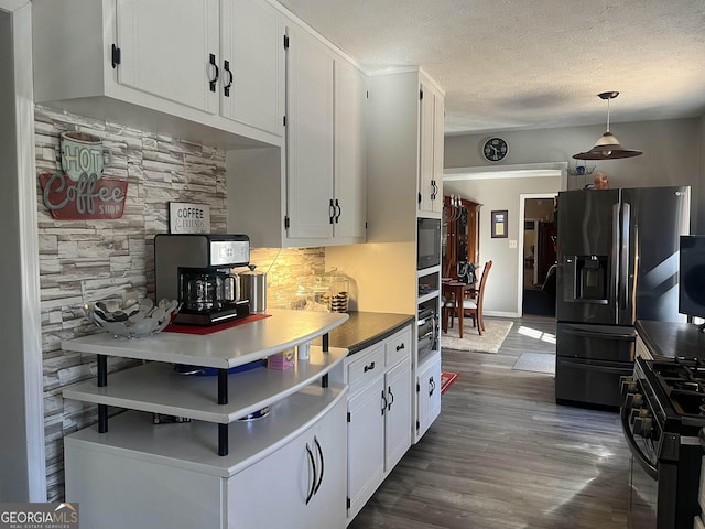 kitchen featuring white cabinetry, black appliances, a textured ceiling, and dark wood-type flooring