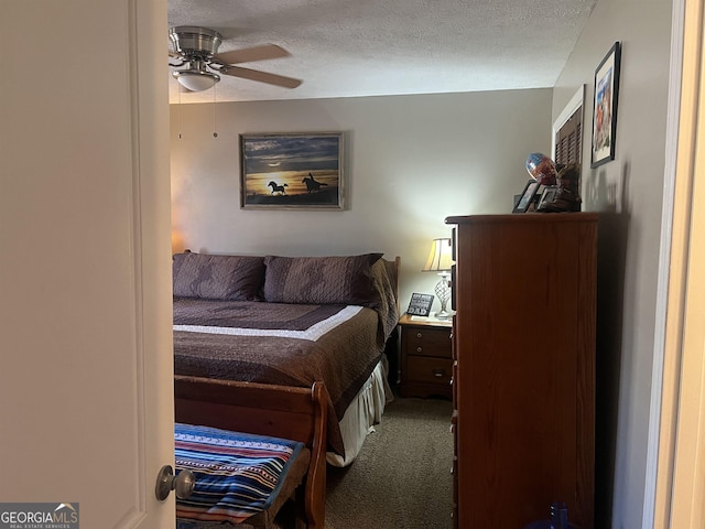 carpeted bedroom featuring a textured ceiling