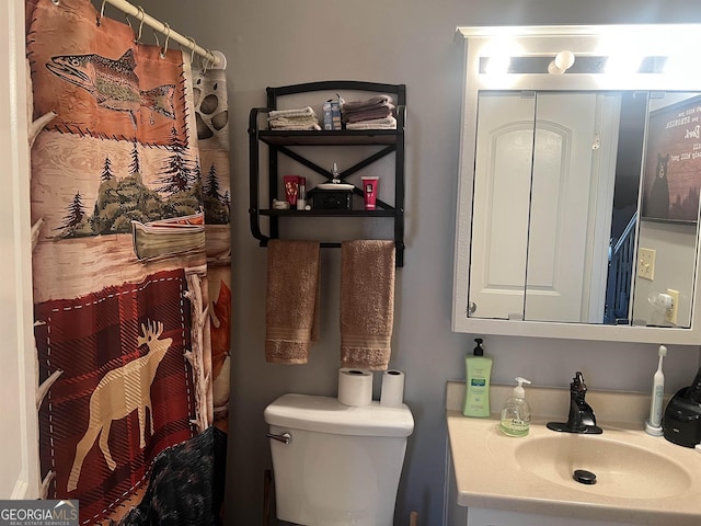 bathroom featuring toilet and sink