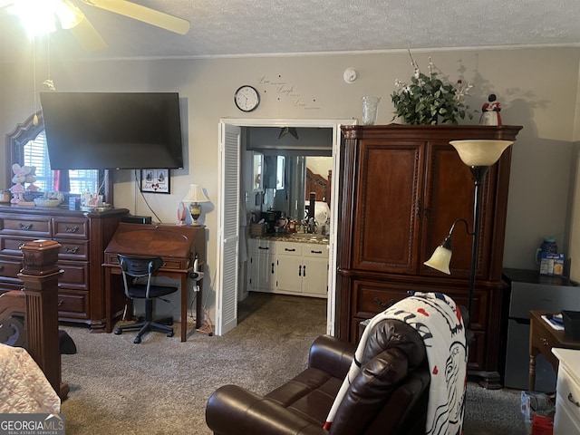 interior space featuring a textured ceiling and ceiling fan