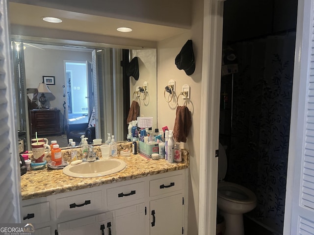 bathroom with vanity and toilet