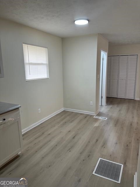 interior space featuring a closet and light hardwood / wood-style floors