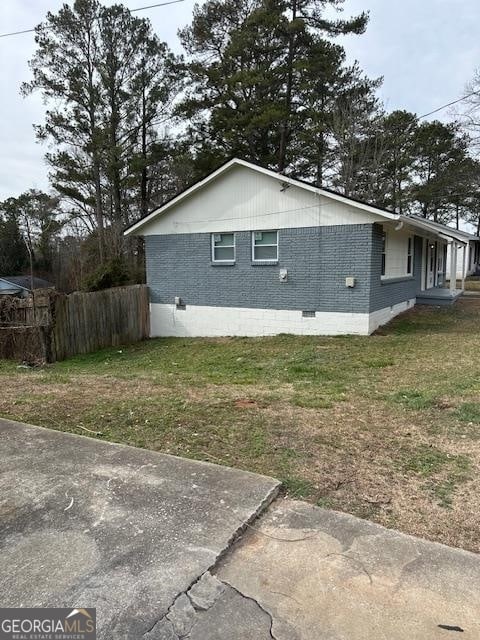 view of home's exterior featuring a lawn