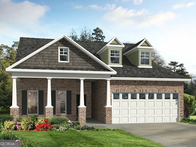 view of front of property with a front lawn and a garage