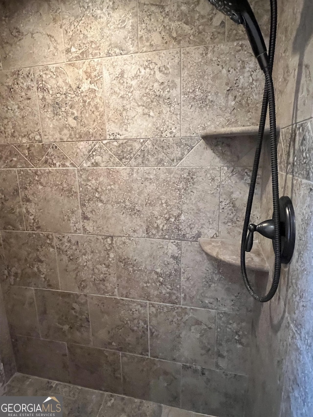 details featuring a tile shower