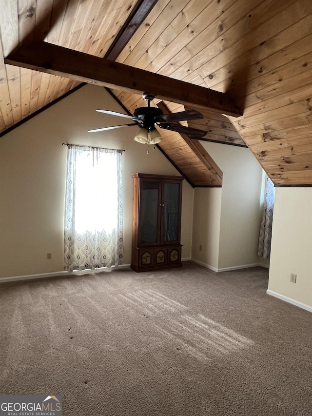 bonus room with lofted ceiling with beams, ceiling fan, carpet floors, and wooden ceiling