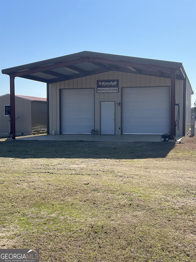 garage with a yard