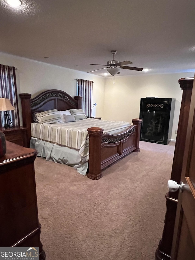 bedroom with ceiling fan and carpet flooring