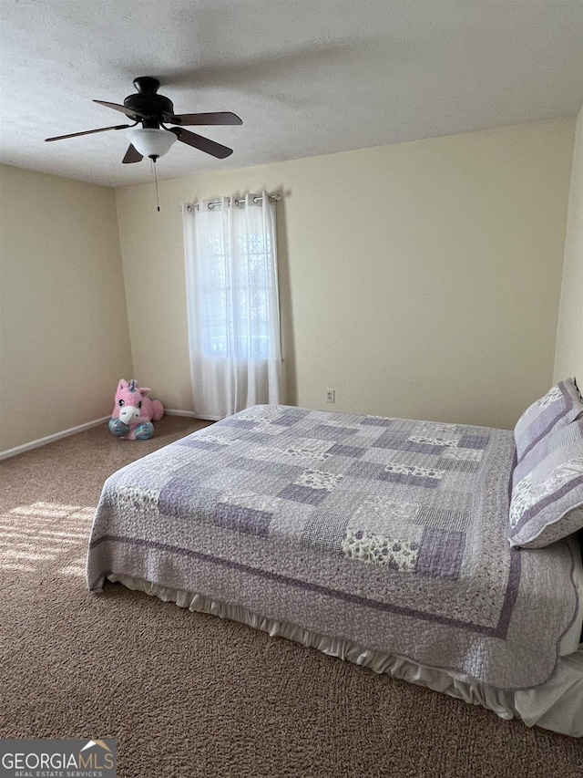 bedroom featuring ceiling fan and carpet flooring