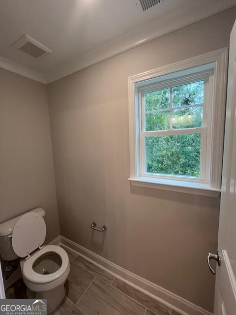 bathroom featuring toilet