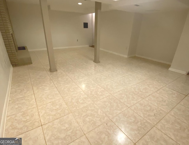 basement featuring light tile flooring