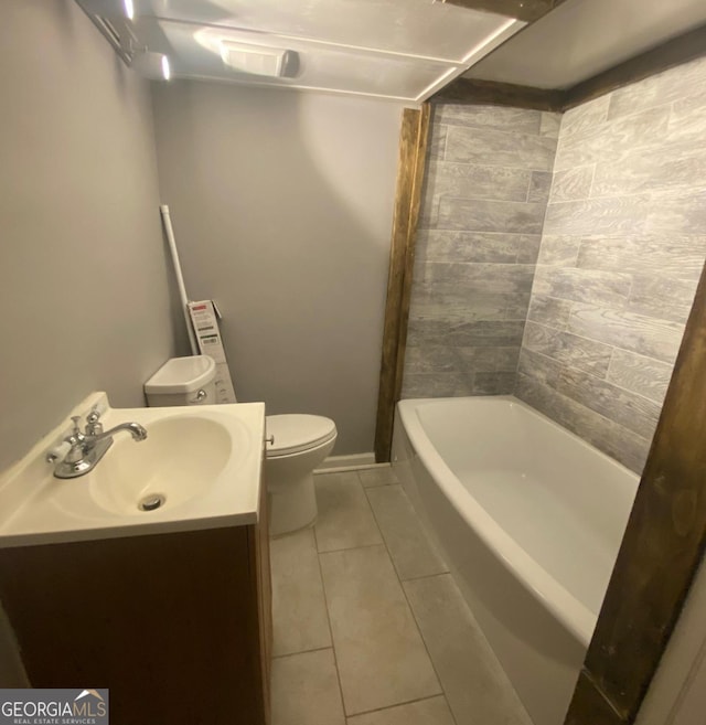 full bathroom with washtub / shower combination, vanity, toilet, and tile floors