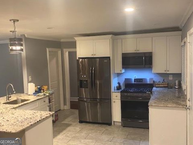 kitchen with pendant lighting, white cabinets, sink, light tile floors, and appliances with stainless steel finishes